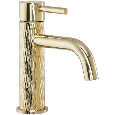 A close-up studio shot of a gold-colored faucet.