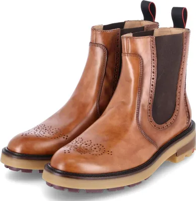 A pair of brown leather Chelsea boots.