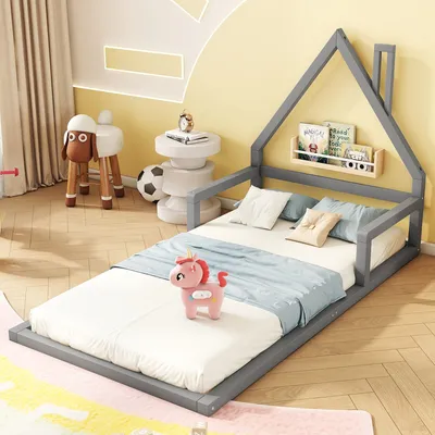 A child's bedroom with a house-shaped bed, a sheep stool, and toys.