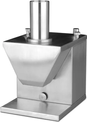 A stainless steel industrial device, possibly a food slicer or dispenser, shown from a slight front-diagonal angle.
