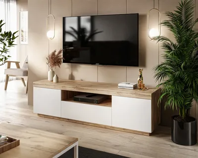 A modern living room with a TV stand and television.