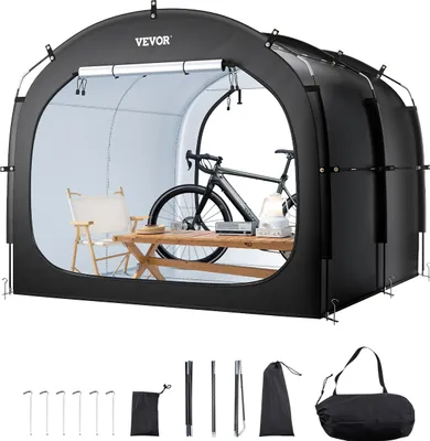 A black bicycle tent is shown with a bicycle, table, and chair inside. Various accessories are laid out below the tent.