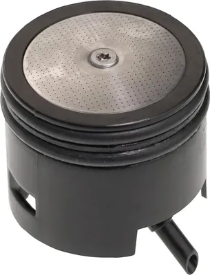 A close-up studio shot of a coffee machine brewing head.