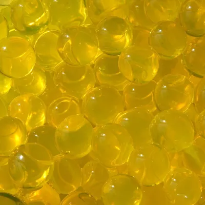 Produktbild von Wasserperlen in vielen Farben wählbar, Ø 10-12mm, Beutel mit ca. 35g, für 4 Liter Wasser | Aquaperlen | Gelee-Kristallkugeln | Vasenfüller | Aqualinos | Hydroperlen, Farbe:Transparent, Farbe:Gelb, Farbe:Gelb