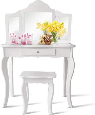 A white vanity table with a tri-fold mirror, a stool, and decorative items.