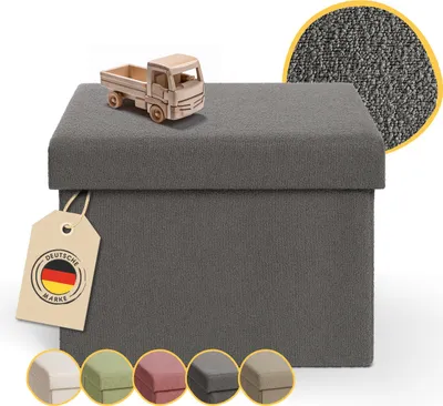 A dark gray storage ottoman with a small wooden truck on top, and a close-up of the fabric texture. Several color swatches are shown at the bottom.