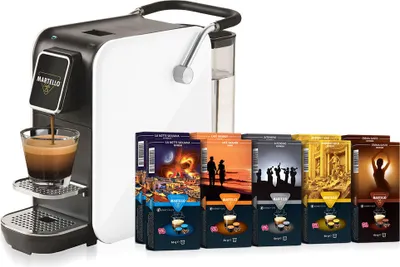 A coffee machine with several boxes of coffee capsules.