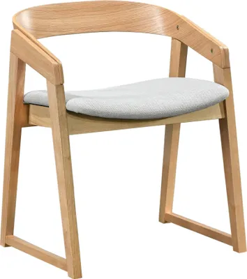 A studio shot of a wooden chair with a light gray upholstered seat.