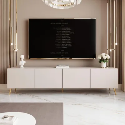 A modern living room with a TV stand and a large television displaying credits.