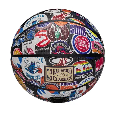A basketball covered in various NBA team logos and emblems.