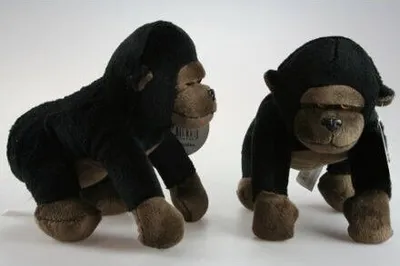 Two plush gorillas on a white background.