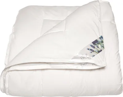 A white comforter is folded and displayed against a white background.