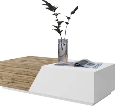 A modern coffee table with a split design, one side white and the other wood-grained, with a vase of dark foliage and an open magazine on top.