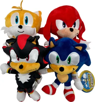 A group of four Sonic the Hedgehog character plush toys arranged together.
