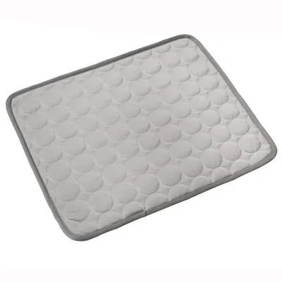A light gray cooling mat with a pattern of circles, bordered by a darker gray edge, is shown on a white background.