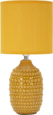 A table lamp with a textured base and a yellow fabric shade.