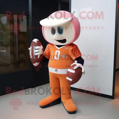 Produktbild von Pfirsichfarbener REDBROKOLY Maskottchen Kostüm mit American-Football-Helm bekleidet mit einem Rugby-Shirt und Clutch-Taschen