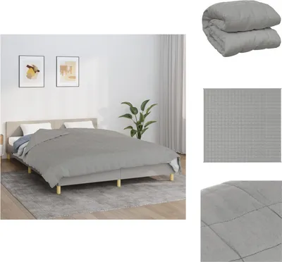A bedroom scene with a bed, bedding, and artwork on the wall.