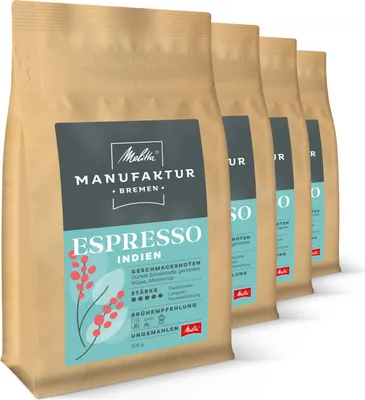 A row of coffee bags, with the front bag in focus.