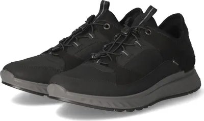 A pair of black Ecco Exostride sneakers.