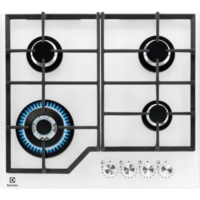 A top-down view of a white gas stovetop with four burners, one of which is lit with blue flames.