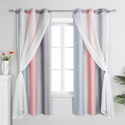 A pair of curtains with a gradient color pattern and sheer overlays are displayed in front of a window.