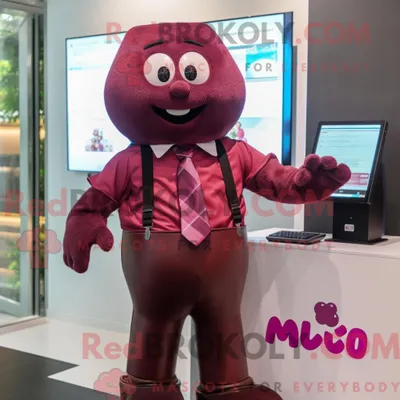 Productafbeelding van Mascottekarakter REDBROKOLY van magenta chocolaatjes gekleed met een overhemd met knopen en armbanden