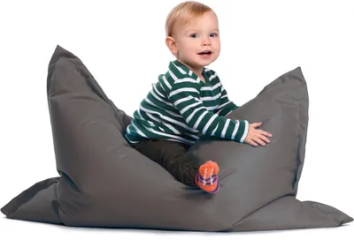 A baby sits on a large gray beanbag chair.