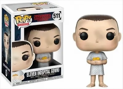 A Funko Pop! vinyl figure of Eleven from Stranger Things, shown in its original packaging and also displayed outside the box.