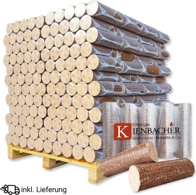 A large stack of firewood briquettes on a wooden pallet, with some individual briquettes in the foreground.