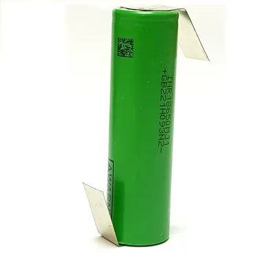 A single green battery with metal tabs attached to the top and bottom.