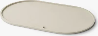 A single oval-shaped placemat on a white background.