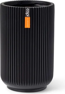 A black ribbed planter pot with an orange label.