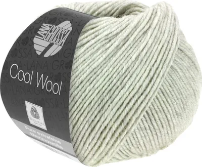 A ball of light gray melange yarn with a dark gray label.