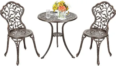 A bronze bistro set with a round table and two chairs, set against a white background.