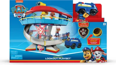 The image shows the packaging of a Paw Patrol Lookout Playset, featuring the playset itself, toy vehicles, and characters.