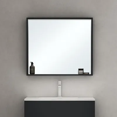 A bathroom vanity with a mirror above it.