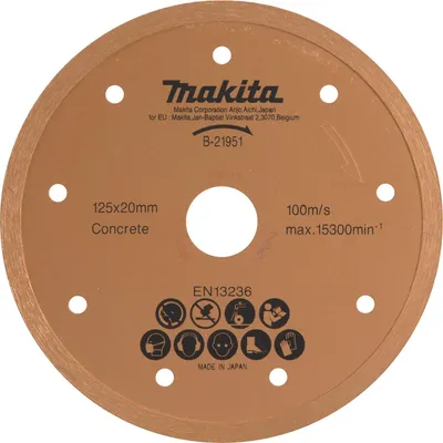 A close-up, top-down view of a circular cutting disc with text and symbols printed on it.