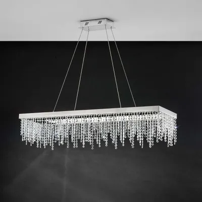 A rectangular chandelier with crystal droplets hanging from a silver frame, suspended from the ceiling.