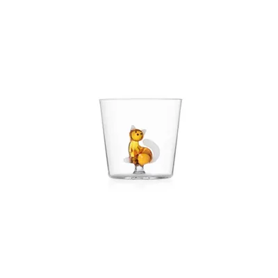 A clear, professional studio shot of a glass tumbler with a decorative amber-colored cat figurine inside.