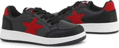 A pair of black and red sneakers on a white background.