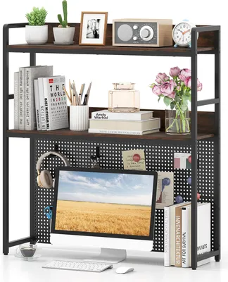 A desk shelf unit with a monitor, keyboard, mouse, books, and decorative items.