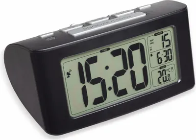 A black digital alarm clock with a large LCD display.