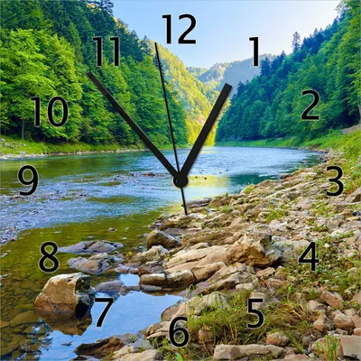 Produktbild von Wallario Design Wanduhr Fluss in den Bergen an steinigem Ufer aus Echtglas, Größe 30 x 30 cm