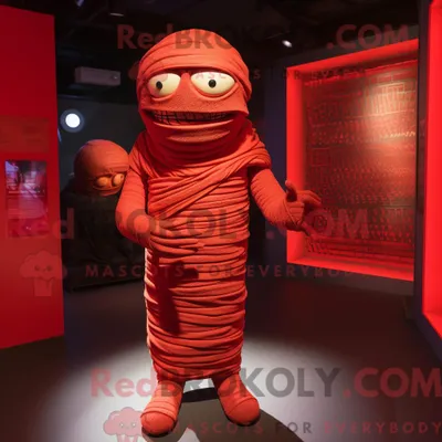 Produktbild von Maskottchenfigur REDBROKOLY einer roten Mumie mit Overall und Umhang