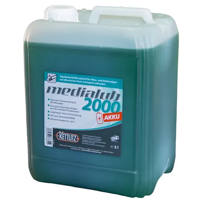 A large plastic container of green liquid, likely oil, with a label on the front.
