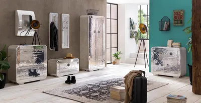 A stylish entryway or living space featuring industrial-inspired furniture and decor.