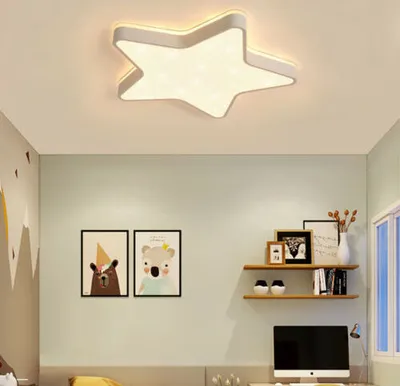 A star-shaped ceiling light fixture in a child's room.