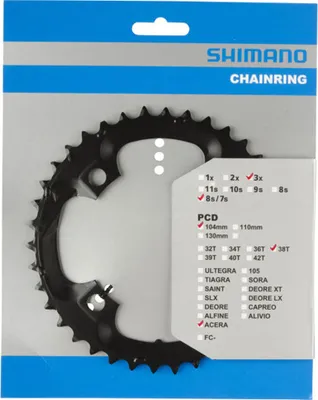 A Shimano chainring is displayed in its retail packaging.