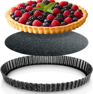 A berry tart and its components are displayed against a white background.